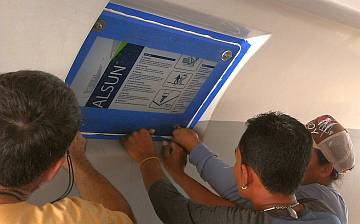 Screwing the 4 bolts through the polycarbonate, into the hull