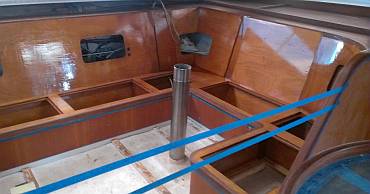 Lek got the first coat of gloss polyurethane on the salon seats